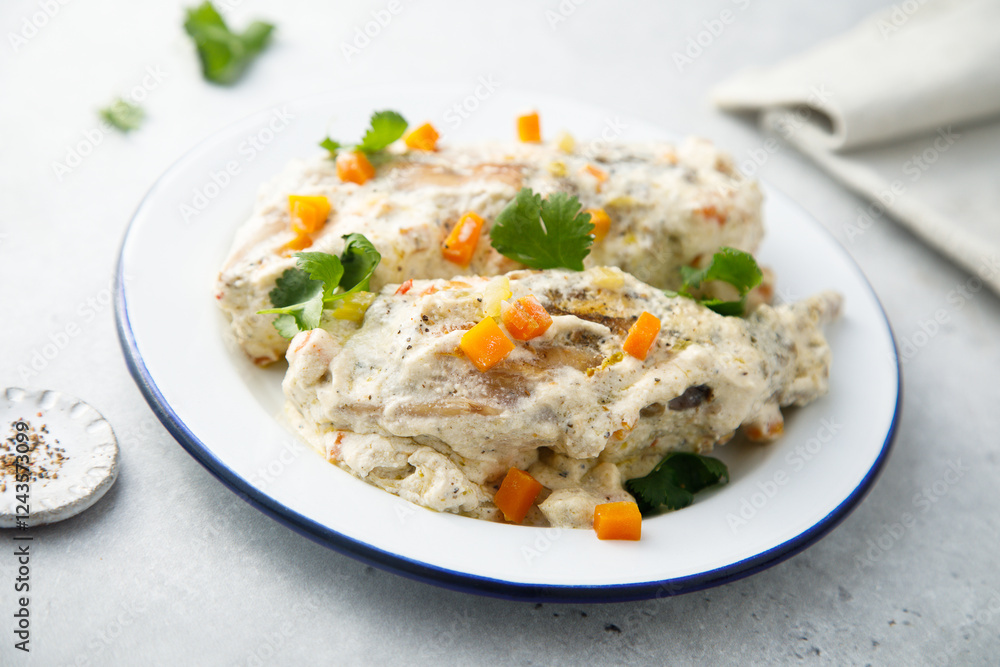 Rabbit with sour cream sauce and vegetables Rabbit with sour cream sauce and vegetables