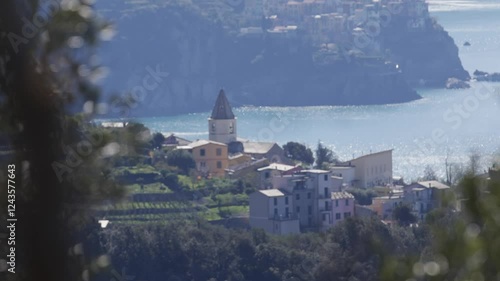 Wallpaper Mural A beautiful view of a town with a church and a body of water. The town is surrounded by trees and the water is calm Torontodigital.ca