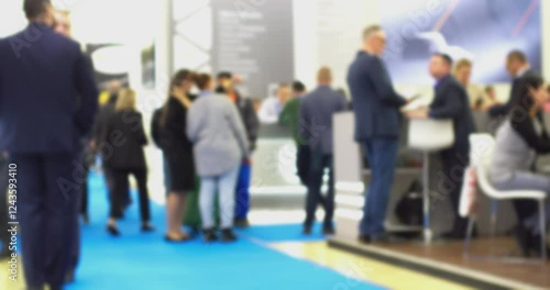 Businessman walking through busy conference hall