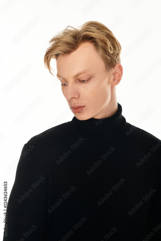 Young handsome man exhibiting stylish elegance in a modern and minimalistic setting Young handsome man exhibiting stylish elegance in a modern and minimalistic setting