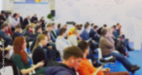 Wallpaper Mural Blurry audience and speaker interaction at busy conference Torontodigital.ca