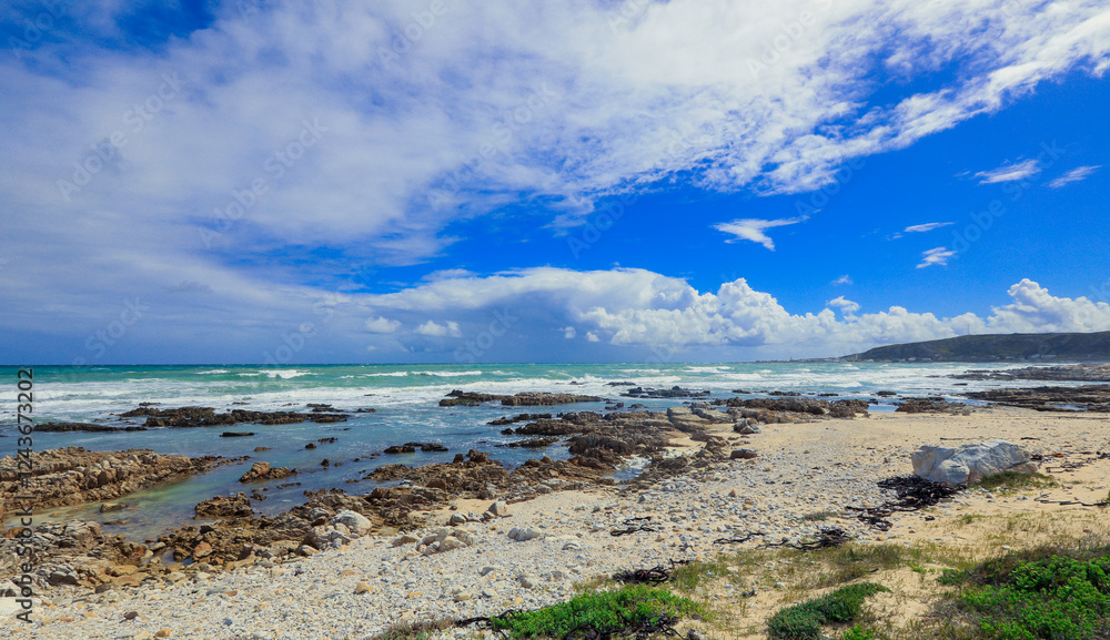 Stunning coastal landscape in South Africa showcasing serene beaches and vibrant skies Stunning coastal landscape in South Africa showcasing serene beaches and vibrant skies