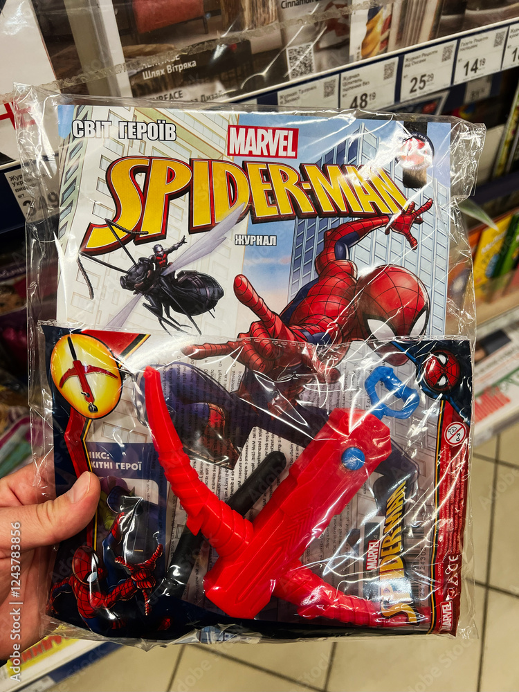 Obraz premium Kyiv, Ukraine - February 04, 2025: Spider Man theme toy set and comic magazine bundled and displayed in a store.