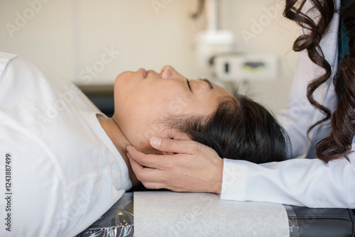 Doctor touching a trigger point on the patients neck