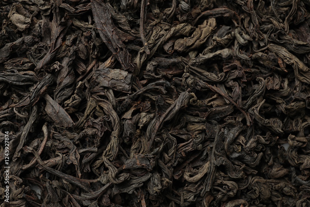 Pile of dry tea leaves as background, top view Pile of dry tea leaves as background, top view
