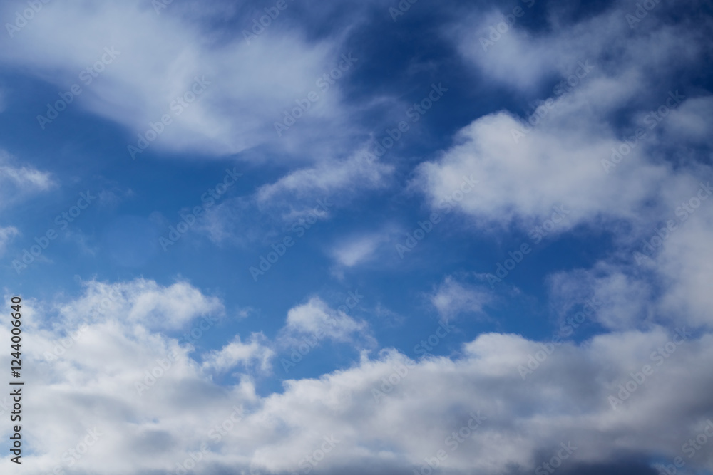 Fototapeta premium White feathery clouds in the blue sky