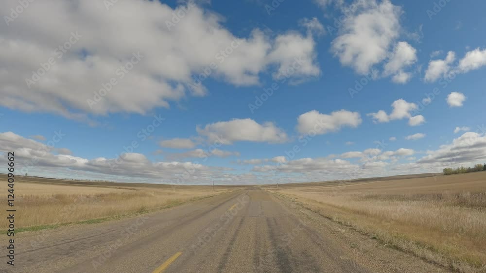 Action camera from front of car driving across a dry grassy ranch under a blue sky
Action camera from front of car driving across a dry grassy ranch under a blue sky