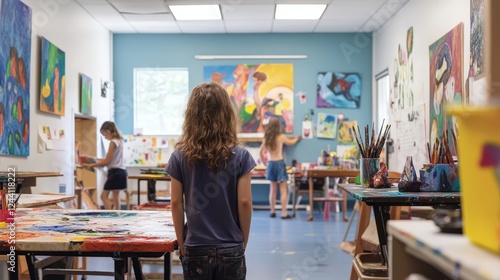 A creative arts class with students painting and sculpting