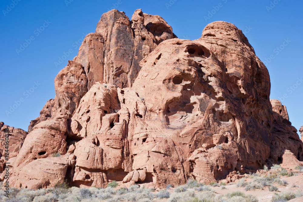 Eroded Red Rock Formation Against Blue Sky Eroded Red Rock Formation Against Blue Sky