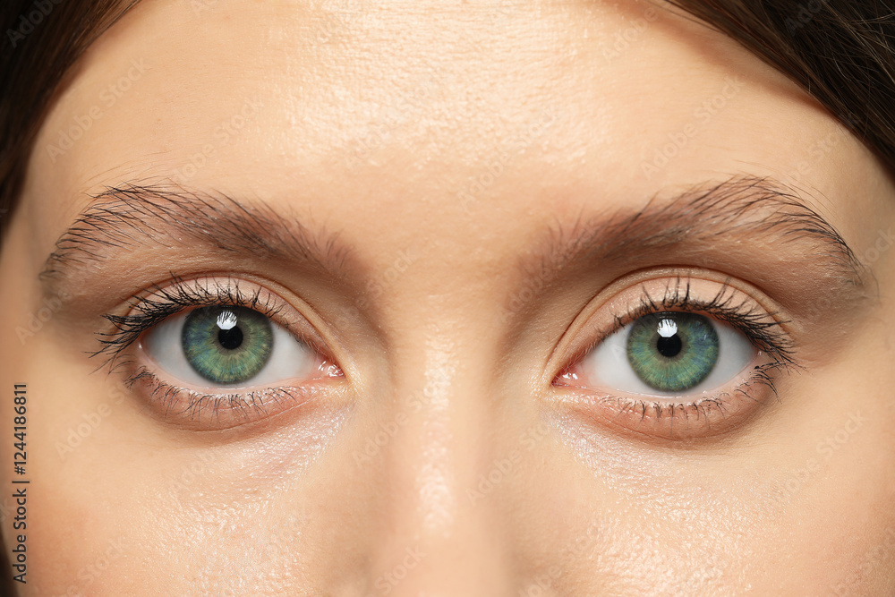 Closeup view of woman with green eyes Closeup view of woman with green eyes