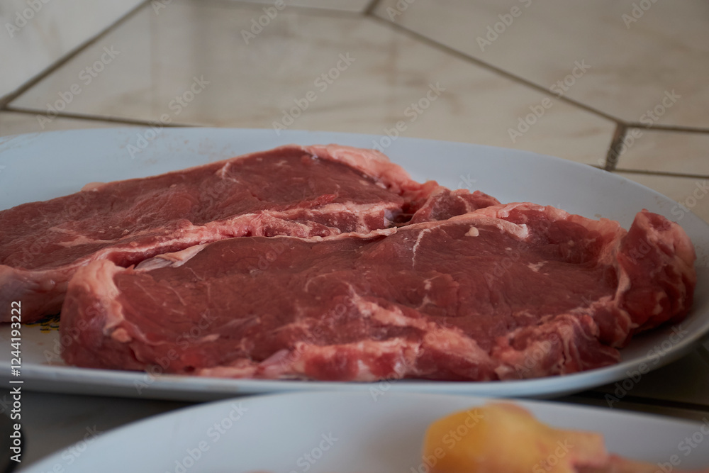 Raw beef steaks with marbled texture for BBQ cooking Raw beef steaks with marbled texture for BBQ cooking