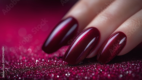 Elegant red manicure showcasing long, glossy nails against a sparkling backgr...