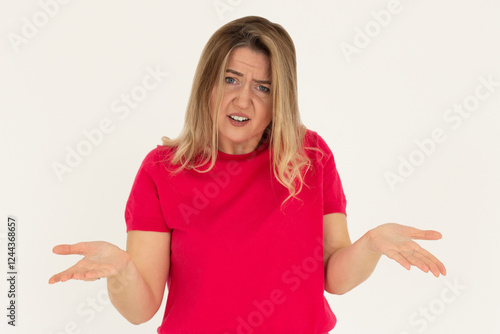 Wallpaper Mural Confused thoughtful confused young woman holding copy space on palm over white background Torontodigital.ca