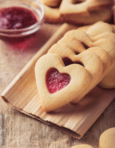 Create Delicious Heart Shaped Baked Butter Cookies Filled with Jam for Desserts and Snacks Perfect for Finger Food Lovers and Cookie Enthusiasts at Any Gathering photo