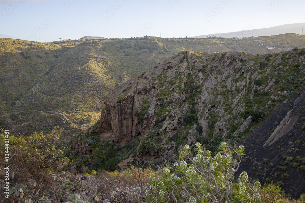 Rugged mountain landscape Bandama Caldera, Gran Canaria, with a prominent rock cliff or outcrop.