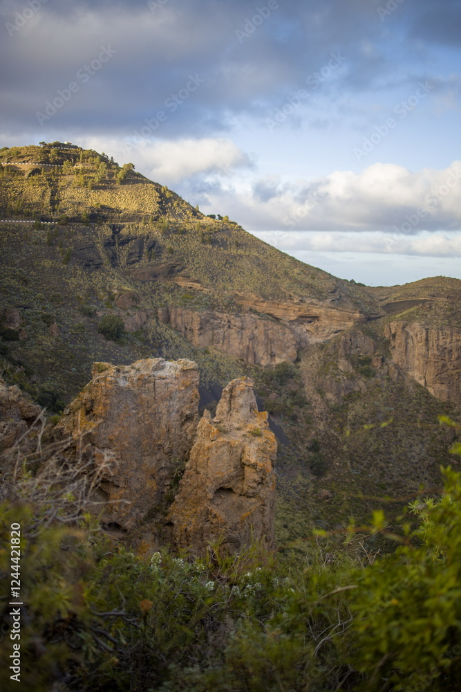 Rugged mountain landscape Bandama Caldera, Gran Canaria, with a prominent rock cliff or outcrop.