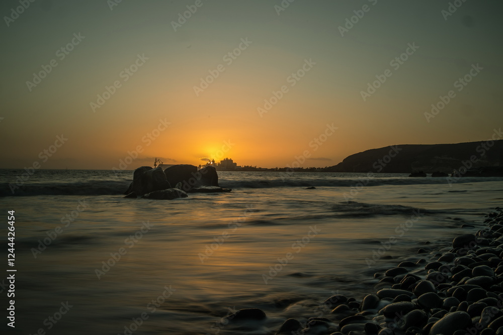 Rocky beach in Gran Canaria at sunset, sunrise.