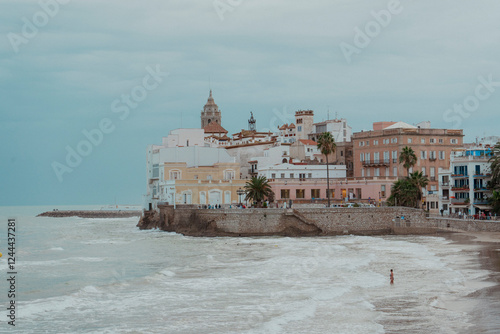 Sitges, Barcelona, Spain. November 1, 2024: Landscape in the old town on the beach San Sebastian. photo