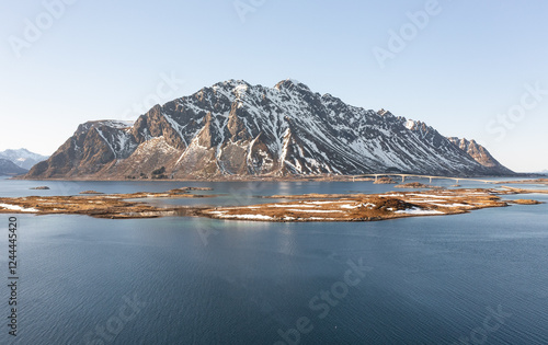 A drone shot of a large snowy mountain in Norway.