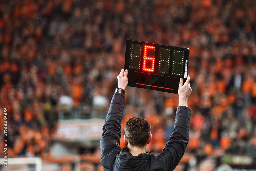 Technical referee shows 6 minutes added time during the football match.