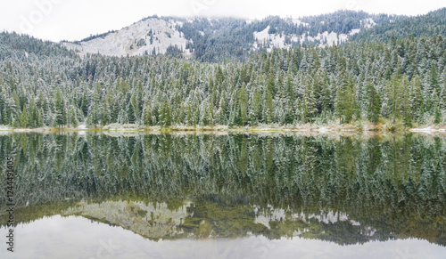 USA, Washington State. Central Cascades, Olallie Lake and fir trees with snow photo