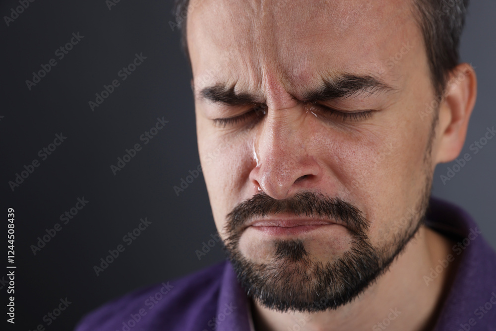Sad man crying on grey background, closeup. Space for text Sad man crying on grey background, closeup. Space for text