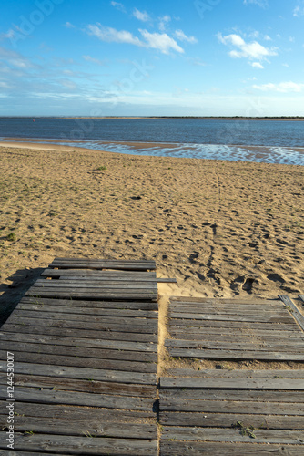 El Portil beach, between the municipalities of Cartaya and Punta Umbría. The sun bathes long, beautiful kilometers of white sand. Andalusia, Spain. vacations concept photo