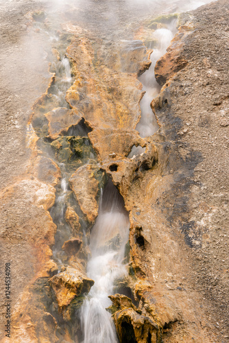 USA, Wyoming, Yellowstone National Park. Travertine deposits form along the o...