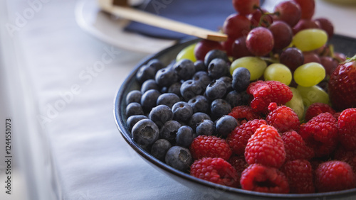 Obraz na płótnie Different fruit such as blueberries, raspberries, grapes and strawberries on a display at a gala event or banquet. Self service food.. w salonie