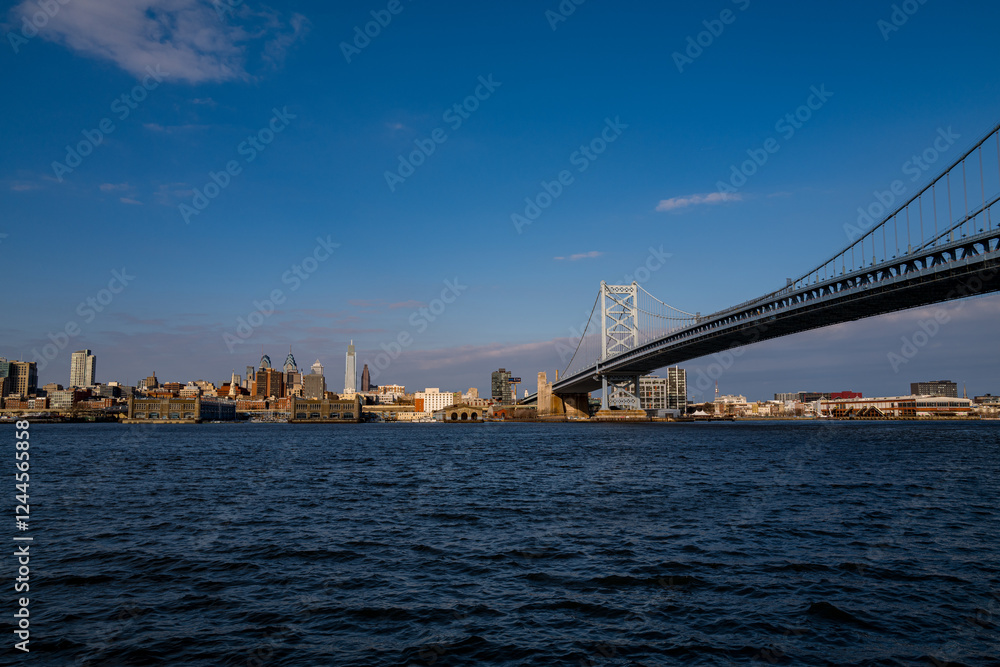 Obraz premium The architectural beauty that is the Ben Franklin Bridge spanning across the Delaware River between Camden NJ and Philadelphia Pennsylvania