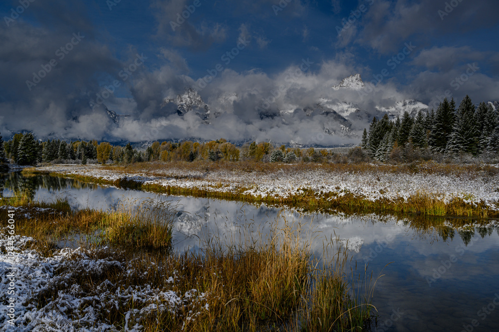 Fototapeta premium USA, Wyoming. Landscape of snow on mountains and Snake River wetland, Grand Teton National Park