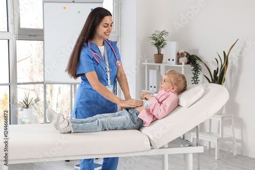 Female pediatrician examini...