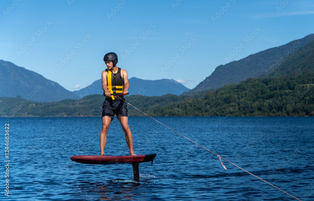 Surfing with Foil Board and Boat in Nature