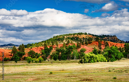 Red hills and plains of Devil's Tower National Monument in Wyoming photo