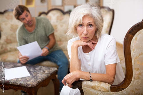 Quarrel between husband and wife in the apartment photo