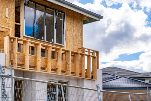 Konstfotografi Raw construction phase of a residential building, the framework of a balcony and upper-level extension of a two-story house