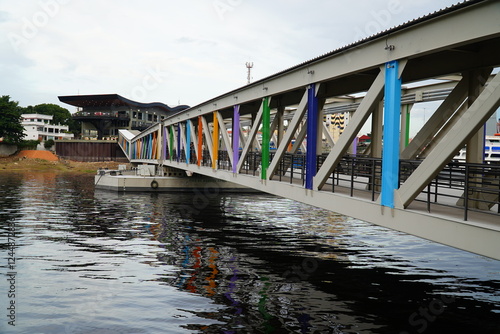 Steel structure of the pedestrian passage to a new floating pontoon in the marine harbor district of Manaus, Mirante Lucia Almeida district, state of Amazonas, Brazil. photo