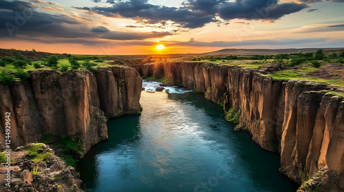 Sunset Illuminates a Deep River Gorge with Steep Cliffs and Lush Vegetation