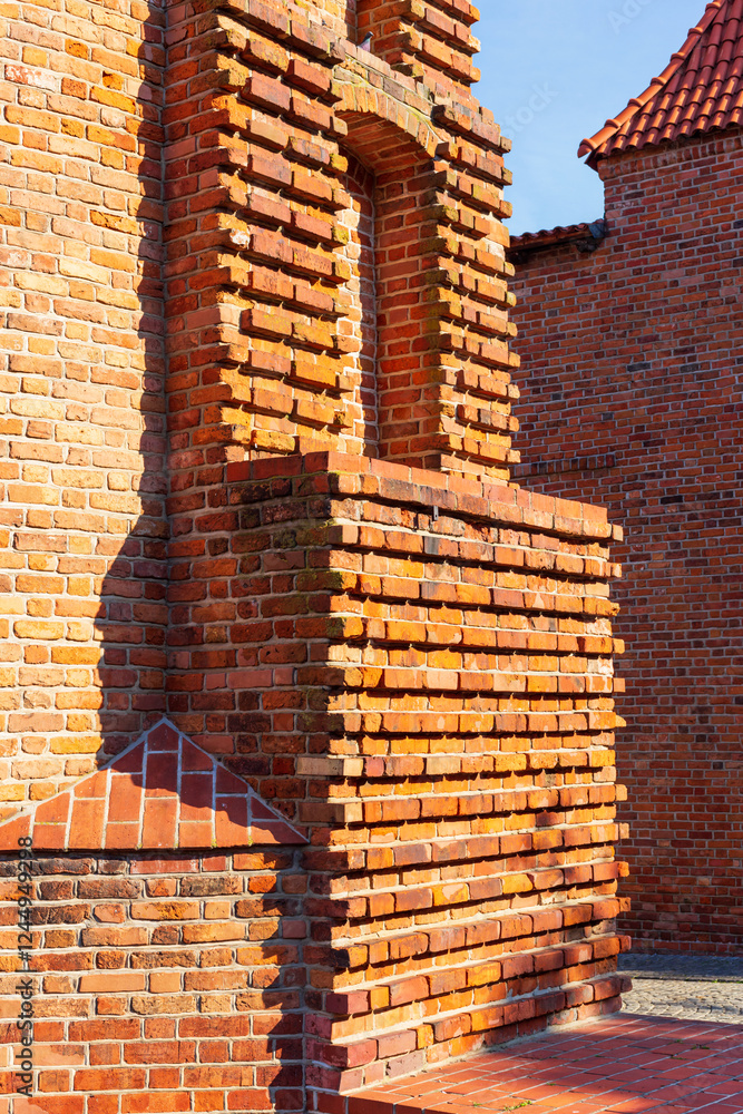 Cityscape - view of the walls of the medieval fortress building of the Warsaw Barbican in the Old Town of Warsaw, Poland