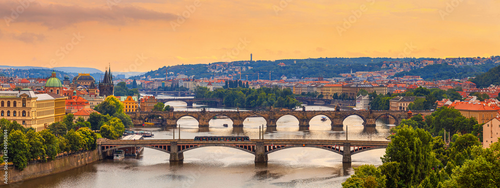 Summer cityscape, panorama, banner - top view of the historical center of Prague and the Vltava river with bridges, Czech Republic