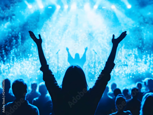 Silhouetted Fan Raises Hand...