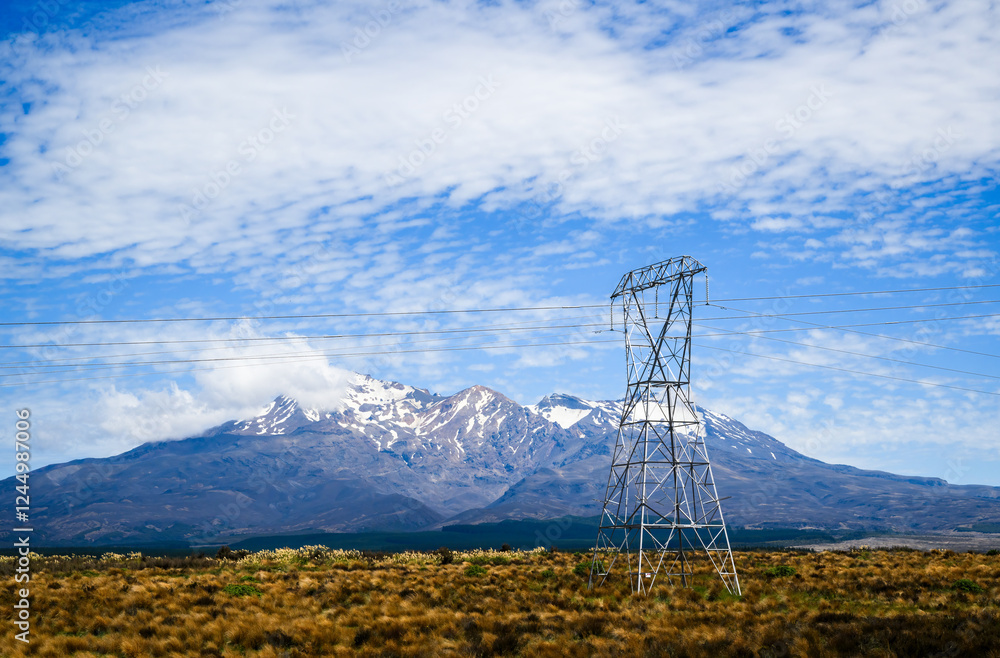 View of Mt Ruapehu with power pylons and power lines along Desert Road. Tongariro National Park. New Zealand.