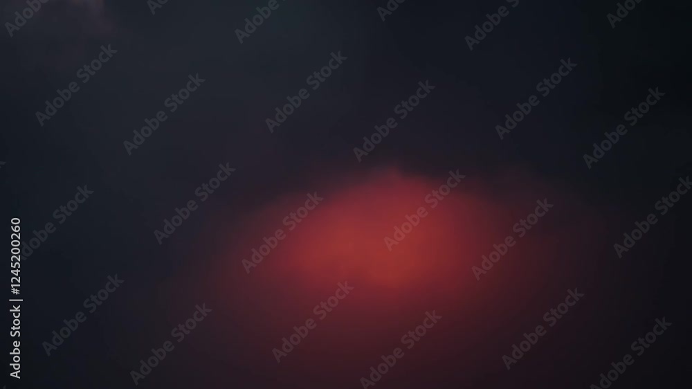 Volcan de Fuego, Guatemala, aerial view of Volcano erupting at night shrouded in cloud with lightning flashes Volcan de Fuego, Guatemala, aerial view of Volcano erupting at night shrouded in cloud with lightning flashes