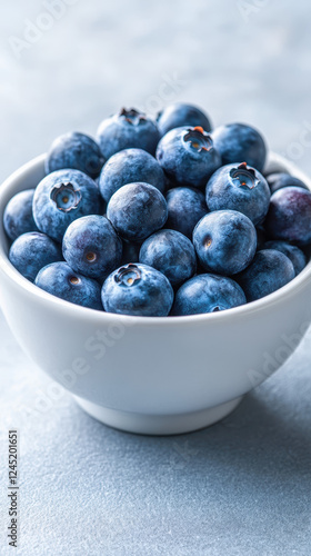Fresh blueberries in small white bowl, perfect for healthy snacking