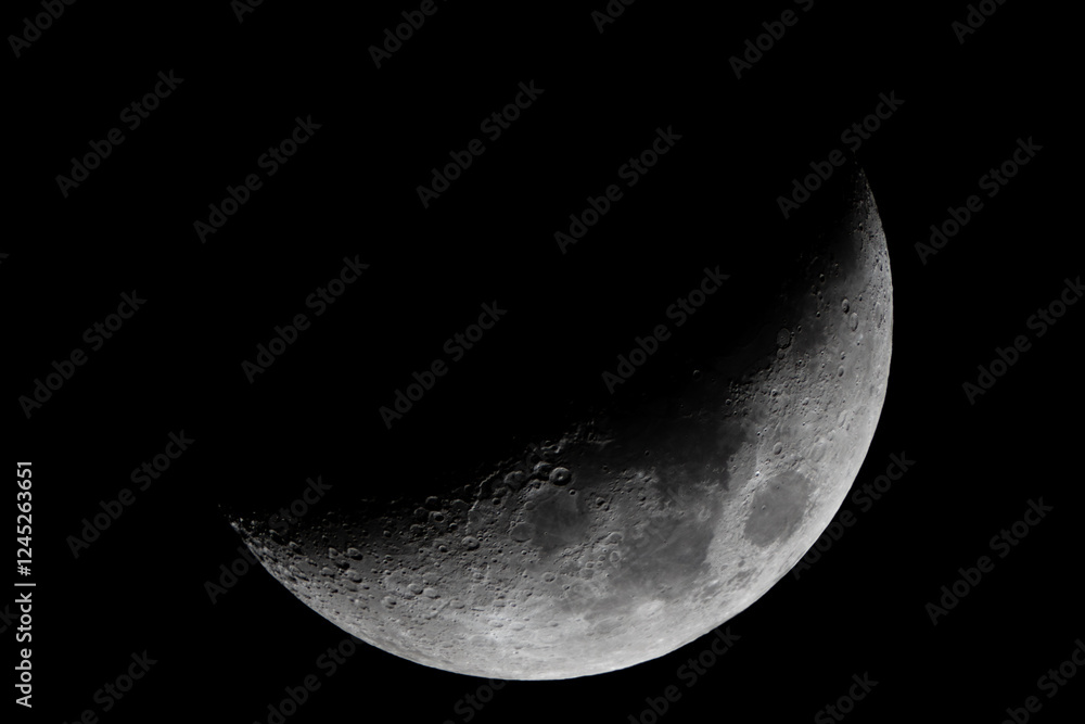 Crescent Moon Close-Up Featuring Detailed Craters in the Night Sky