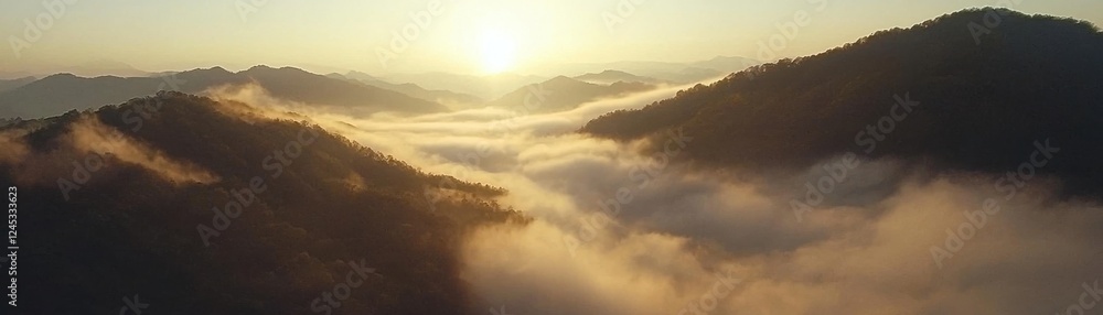 Breathtaking view of mountains emerging from the clouds during sunrise, creating a serene and majestic atmosphere in nature. Breathtaking view of mountains emerging from the clouds during sunrise, creating a serene and majestic atmosphere in nature.