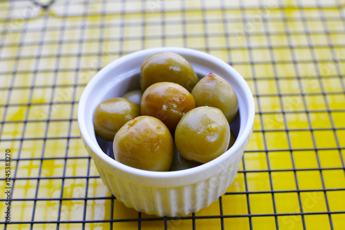 Pickled Chinese plums or Japanese apricots photo