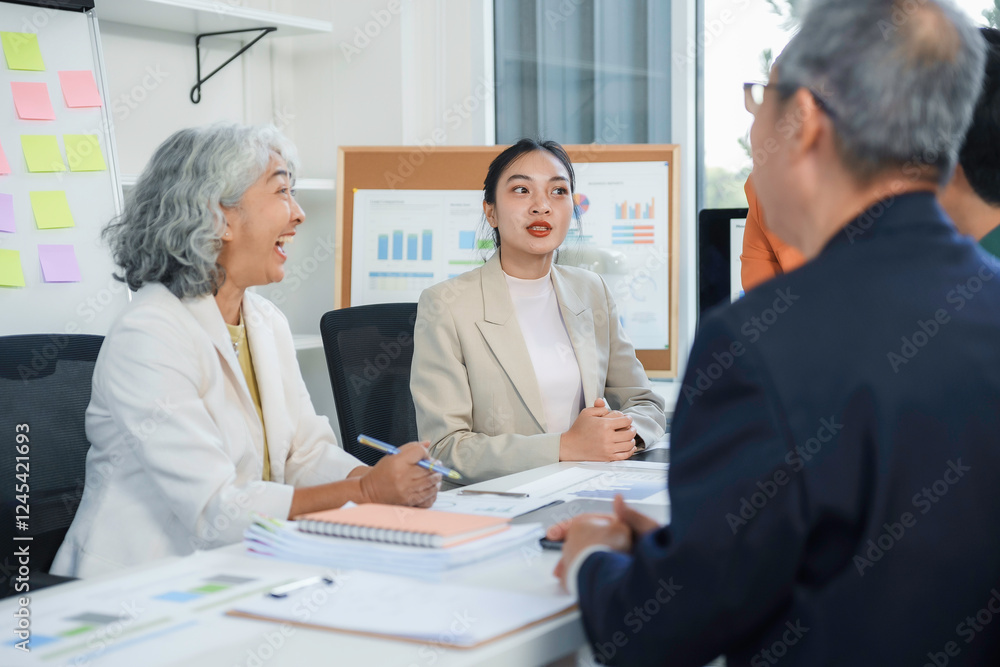 Fototapeta premium Businesswomen discussing strategy with colleagues during corporate meeting