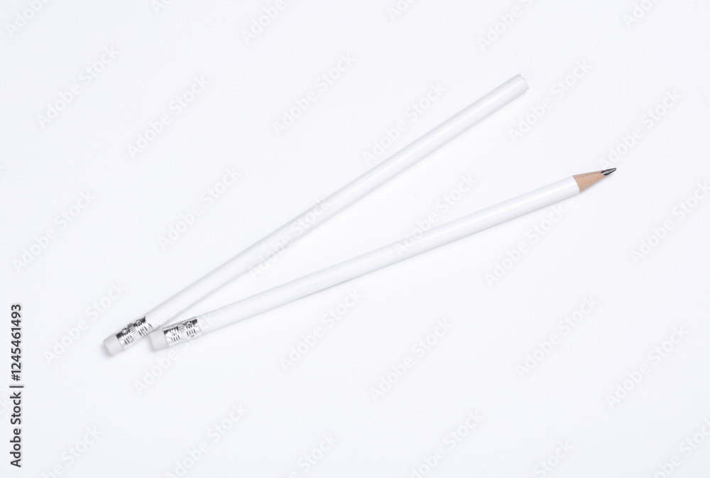 Fototapeta premium White wooden pencils with erasers on white background. Mockup for design