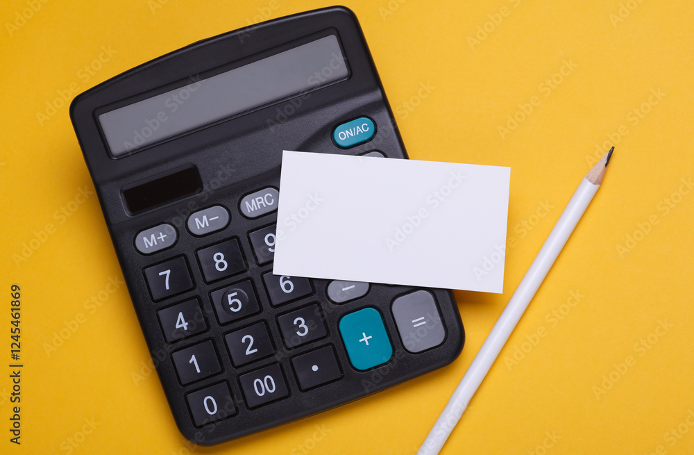 Calculator with business card and pencil on yellow background Calculator with business card and pencil on yellow background